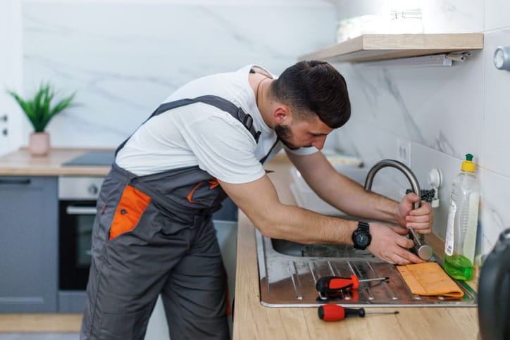 Plumber in Westland working on Sink